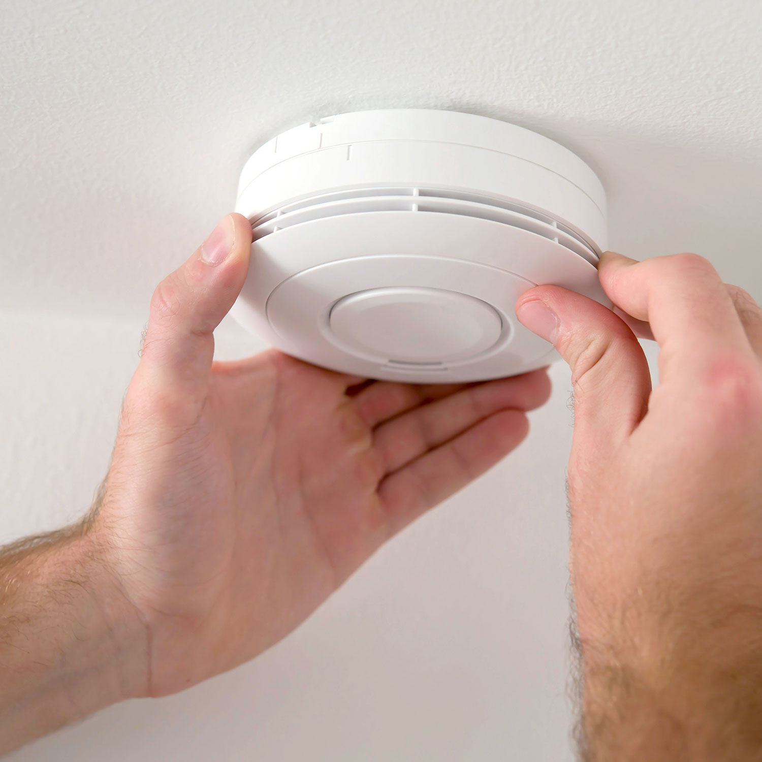 Smoke alarm being installed