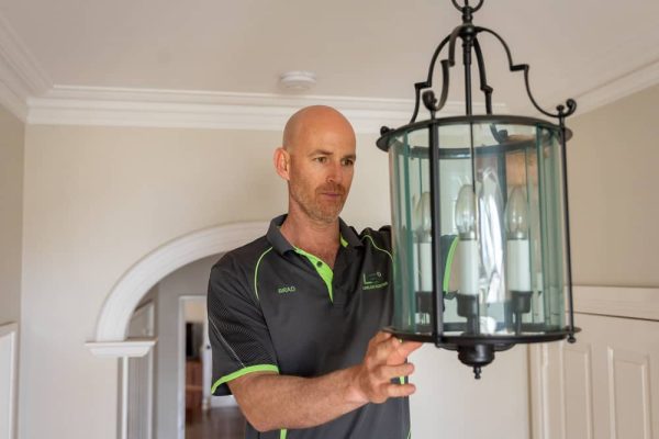 why-choose-limelight-electrix-for-chandelier-feature-light-installation Limelight Electrix electrician installing a hanging chandelier and feature lights in a Perth home